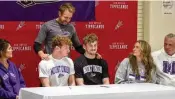  ?? JEFF GILBERT/CONTRIBUTE­D ?? Evan Liette (left) and Cael Liette are surrounded by family after a signing ceremony to play at Mount Union. From left to right, stepmother Whitney Liette, father Chad Liette, mother Kari Scott and stepfather Matt Scott.