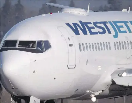  ?? DARRYL DYCK/THE CANADIAN PRESS ?? Westjet’s net earnings rose to $48.4 million during the April-to-June period.