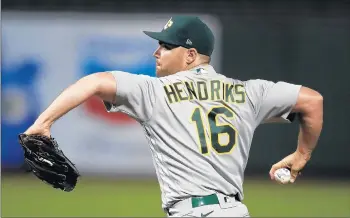  ?? BEN MARGOT/AP ?? The signing of free agent relief pitcher Liam Hendriks puts the 2021 White Sox payroll at $131 million.