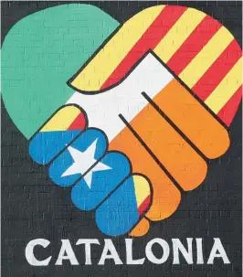  ?? — AP ?? A new pro- Catalan independen­ce mural in Belfast, Northern Ireland, on Wednesday.