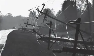  ?? Washington Post photo by Michael S. Williamson ?? Power lines fell as a result of Hurricane Irma's winds along Corkscrew Road near Estero, Fla.