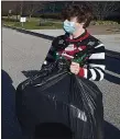  ?? PETE BANNAN - MEDIANEWS GROUP ?? O’Hara students including junior Jack Gallagher of Havertown dressed in his festive Christmas sweater helped pack gifts for Operation Santa Claus Tuesday morning.