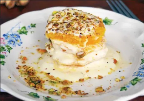  ?? PHOTO BY EMILY RYAN ?? This orange napoleon dessert features fresh fruit, Greek yogurt, pistachios and honey.