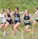  ?? GILLIS/FOR CAPITAL GAZETTE
JOHN ?? Severna Park’s Kaylee Jenish, left center, and teammate Kathryn Murphy run in the girls varsity elite race during the Bull Run Invitation­al cross country race at Hereford High School in Parkton on Saturday. Severna Park’s girls won the top team title.