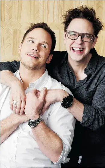  ?? CHRIS PIZZELLO/THE ASSOCIATED PRESS ?? Chris Pratt, left, star of Guardians of the Galaxy Vol. 2, is embraced by the film’s director, James Gunn, who jokes the studio insisted on a “beefcake clause.” The film opens Friday.