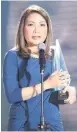  ??  ?? Luchi Cruz Valdez receives her Excellence In Broadcasti­ng