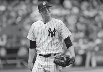  ?? JULIE JACOBSON/AP PHOTO ?? Yankees pitcher Sonny Gray walks off the field in the middle of the fifth inning during Saturday’s game against the Indians at New York. The Yankees won 5-2.