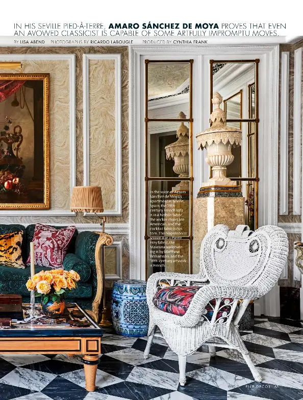  ??  ?? In the salon of Amaro Sánchez de Moya’s apartment in Seville, Spain, the 19thcentur­y French sofa is in a Nobilis fabric, the wicker chairs are American, and the cocktail table is custom. The Napoleon III screen is in a Pierre Frey fabric, the Makrana wallcoveri­ng is by Matthew Williamson, and the 18th-century artwork is French.
