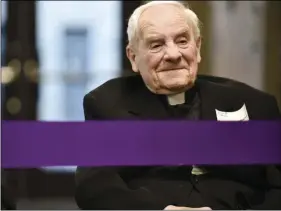  ??  ?? In this Feb. 23, 2017, photo, Archbishop Raymond G. Hunthausen smiles as Carroll College President Dr. Tom Evans tells an endearing story about the archbishop during a dedication ceremony of the newly completed Hunthausen Activity Center in Helena,...