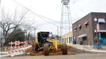  ?? (Photo by Neil Abeles) ?? LEFT: The grader is on Rush Street at its intersecti­on with South Main Street in Linden. It is the last part of a downtown grant. Portland cement powder will be added to the soil, mixing and compacting it to strengthen the road base. This will set up for 10 days and then the road will be ready for asphalt paving.