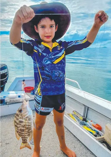  ??  ?? WHAT A BEAUTY: Tommy Pott, 6, caught this grassy emperor while fishing with family last weekend.