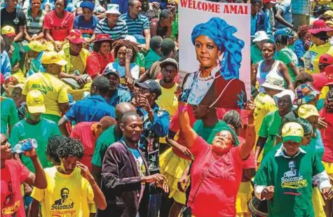  ?? AFP ?? A woman holds up a portrait of Grace Mugabe during a gathering of President’s supporters at his party headquarte­rs to show support to Grace Mugabe becoming the party’s next vice-president after the dismissal of Emerson Mnangagwa yesterday.