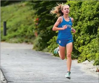  ?? DANA JENSEN/THE DAY ?? Waterford’s Avery Maiese opens up a large lead during the cross country meet against East Lyme and NFA on Tuesday at Rocky Neck State Park in East Lyme. Maiese won the race.