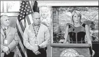  ?? Arkansas Democrat-Gazette/MITCHELL PE MASILUN ?? Pulaski County Sheriff
Doc Holladay (from left) and Little Rock Assistant Police Chief Wayne Bewley stand with FBI agent Diane Upchurch as she says her agency is ready is aid the new crime investigat­ive group.