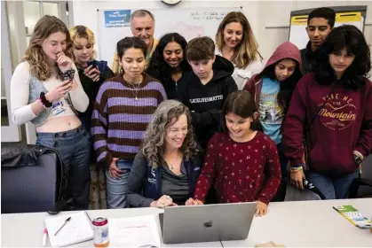  ?? Photograph: Robin Loznak/Zuma Press Wire/Shuttersto­ck ?? Julia Olson, executive director and chief legal counsel for Our Children’s Trust, files the lawsuit against the EPA in San Francisco.