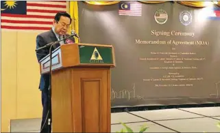  ?? FACEBOOK ?? Labour Minister Ith Sam Heng speaks at the MoU signing ceremony between Cambodia and Malaysia on Wednesday in Kuala Lumpur.