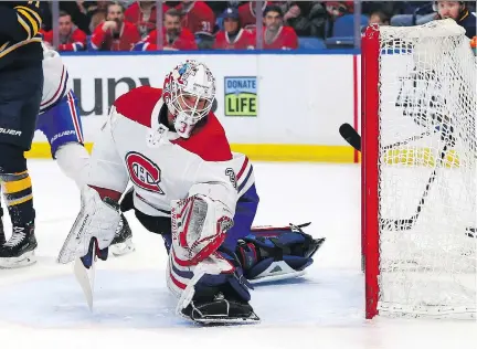  ?? KEVIN HOFFMAN/GETTY IMAGES ?? Antti Niemi makes a glove save as the Canadiens faced off against the Sabres on Friday night in Buffalo. Niemi showed why he should be a hot commodity on the free-agent market, making 34 saves for his first shutout of the season in a 3-0 victory.