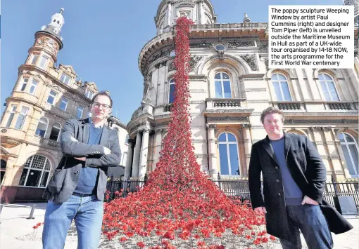  ??  ?? The poppy sculpture Weeping Window by artist Paul Cummins (right) and designer Tom Piper (left) is unveiled outside the Maritime Museum in Hull as part of a UK-wide tour organised by 14-18 NOW, the arts programme for the First World War centenary