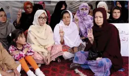  ?? — AP ?? Pakistani lawyer Jalila Haider ( Centre) from Hazara Shia minority community participat­es in a hunger strike with others at a camp in Quetta on Monday. Haider has gone on hunger strike to bring attention to a string of killings of Shias in the city of Quetta.