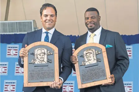  ?? GREGORY J. FISHER, USA TODAY SPORTS ?? Mike Piazza, left, and Ken Griffey Jr. show off their Baseball Hall of Fame plaques.