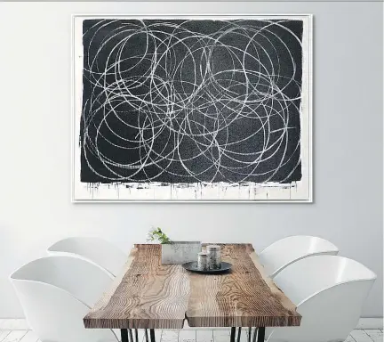  ?? CELADON ART ?? Maison Corbeil’s Chalk Circles Art (65 inches by 50 inches) adds big drama to a neutral space.