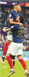  ?? AP ?? Kylian Mbappe celebrates with Theo Hernandez.