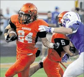  ?? MARC PENDLETON / STAFF ?? Beavercree­k’s Noah Corrigan runs for a short gain. The Beavers mainly stayed on the ground and scored on a series of long drives.