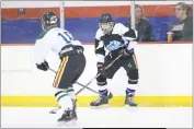  ?? PHOTO BY DARNELL MARBURY ?? Stone’s Damien Hock, right, looks for a passing lane past LaPax defender Ryan Carroll in Friday’s contest at Capital Clubhouse in Waldorf. The teams skated to a 3-3 tie.