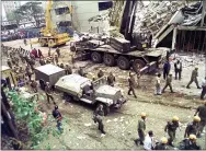  ?? AP PHOTO/SAYYID AZIM, FILE ?? In this Aug. 9, 1998, file photo, Israeli soldiers bring in heavy lifting equipment to the wreckage of the Ufundi House, adjacent to the U.S. embassy in Nairobi. Abu Mohammed al-Masri was widely believed to have participat­ed in the planning of those attacks and was wanted on terrorism charges by the FBI.