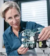  ??  ?? Prof Billard demonstrat­es robotic hand