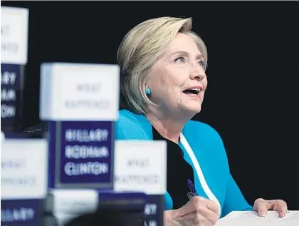  ?? Picture / AP ?? Hillary Clinton is telling her side of last year’s election in her book What Happened, copies of which she signed in New York yesterday.