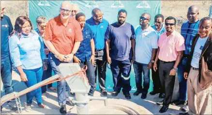  ?? (File pic) ?? RES Corporatio­n Managing Director Nick Jackson posing with the staff during a borehole opening at Gilgal as part of the RES-NDMA partnershi­p.