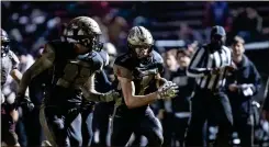  ??  ?? Pepperell’s Payton Rhoades (7) is joined by teammate Levi Lane as he runs into the end zone for a touchdown following a fumble recovery Friday night.