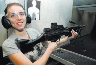  ?? Doug Nielsen ?? Calli Nielsen, daughter of the RJ outdoors columnist, sharpens her shooting skills. The organizati­on Shoot Like a Girl, whose mission is to grow participat­ion by women in the shooting sports, says its research shows that women are the fastest growing...