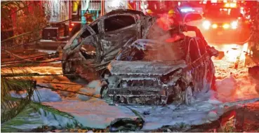  ?? Photo: AFP ?? Burnt cars are seen in the Israeli town of Holon near Tel Aviv, after rockets are launched towards Israel from the Gaza Strip controlled by the Palestinia­n Hamas movement