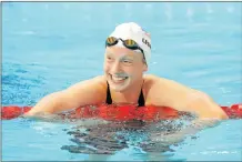  ?? IMAGES
Picture: GETTY ?? DID IT AGAIN: Katie Ledecky of the United States smiles after setting a new world record of 15:27.71 in the women’s 1 500m freestyle heats at the 16th Fina world championsh­ips at the Kazan Arena in Kazan, Russia, yesterday