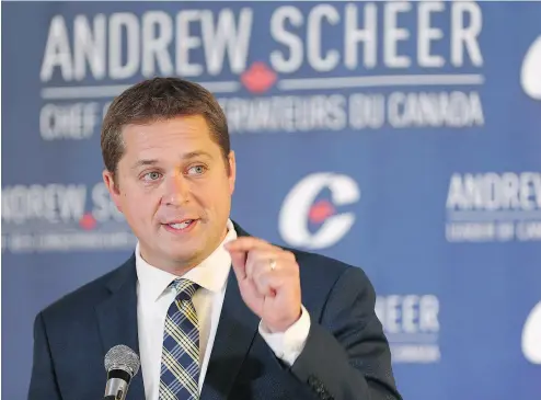  ?? JOHN WOODS / THE CANADIAN PRESS ?? Conservati­ve Leader Andrew Scheer speaks at the party’s caucus retreat Thursday in Winnipeg. Scheer opened the two- day meeting of Conservati­ve MPs and senators by hammering on the Liberal government’s new tax proposal.