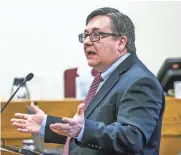  ??  ?? Defense attorney Robert Gundacker delivers opening arguments in the murder trial.