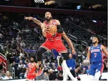  ?? (AP photo/paul Sancya) ?? Chicago Bulls guard Jevon Carter (5) drives on Detroit Pistons guard Marcus Sasser on Thursday during an NBA basketball game in Detroit.