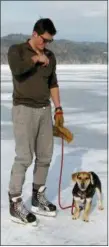  ?? LISA RATHKE — THE ASSOCIATED PRESS ?? In this photo, Jeph Shaw, of Hanover, N.H., skates with his dog on Lake Morey, in Fairlee, Vt., which has a 4.5-mile Nordic ice skating trail, said to be the longest in the United States.