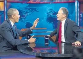  ?? Evan Vucci
Associated Press ?? PRESIDENT OBAMA told “The Daily Show” host: “I’m going to issue an executive order: Jon Stewart cannot leave the show. It’s being challenged in the courts.”