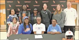  ?? Scott Herpst ?? Lafayette senior softball standout Marquila Howell put her name on a letter of intent Thursday afternoon to play locally for Chattanoog­a State. Joining Howell at the ceremony was Myrikal Blakemore, Kimberly Blakemore and Betty Howell along with (back row, from left) Lucretia Stalling, Marquis Howell, Vicki Burse, Chattanoog­a State head coach Blythe Golden, Lafayette head coach Meagan Base and Lafayette assistant coach Chris Base.