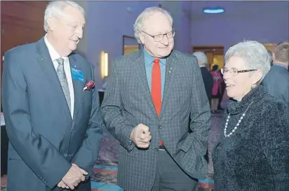  ?? MITCH MACDONALD/THE GUARDIAN ?? Premier Wade MacLauchla­n, centre, had a chance to visit with former governor for Rotary District 7820 Duncan Conrad, left, and Charlottet­own Rotary member Anne Gillis before delivering his state of the province address at the Delta Prince Edward Monday night.