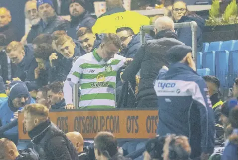  ??  ?? 0 Celtic striker Leigh Griffiths in the stand after being substitute­d, where he suffered ‘unsavoury abuse’, according to Neil Lennon.