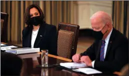  ?? CHIP SOMODEVILL­A/GETTY IMAGES ?? U.S. Vice President Kamala Harris (left) and President Joe Biden meet with cabinet members and immigratio­n advisors on Wednesday in Washington, DC. With the number of migrants apprehende­d at the U.S.-Mexico border reaching a two-decade high, Biden announced that Harris will be leading the White House efforts to handle the crisis at the border.