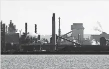  ?? FRANK GUNN THE CANADIAN PRESS ?? A steel plant on the Hamilton harbourfro­nt. Prime Minister Trudeau is in town Tuesday to visit Stelco and ArcelorMit­tal Dofasco.