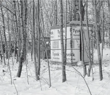  ??  ?? Two temporary shelters and a tent stand in a thicket of trees in Dartmouth on Jan. 25. Halifax Mutual Aid set up both of the shelters to provide what it says is a temporary, Band-aid solution to the city's affordable housing crisis.