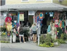  ?? DARREN McGEE/THE ASSOCIATED PRESS ?? Woodstock, N.Y., offers many sidewalk scenes with a colourful countercul­ture feel, even though the famous Woodstock concert was actually held in another locale: Bethel, N.Y.