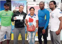  ??  ?? Winners of the tyre challenge, Bruce Williams (second left) and Gavin Francis (second right), getting their prizes from Stokely Rose (left) from TrainFit Club; Sherida Cohen (centre), brand manager at Chas E. Ramson – Foska Oats & Blue Diamond Almond...