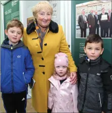  ??  ?? Sheila O’Leary, Kiskeam, with her grand children Daniel, Sinead and Seán at the Dáil 100 Exhibition in Kiskeam Community Centre.